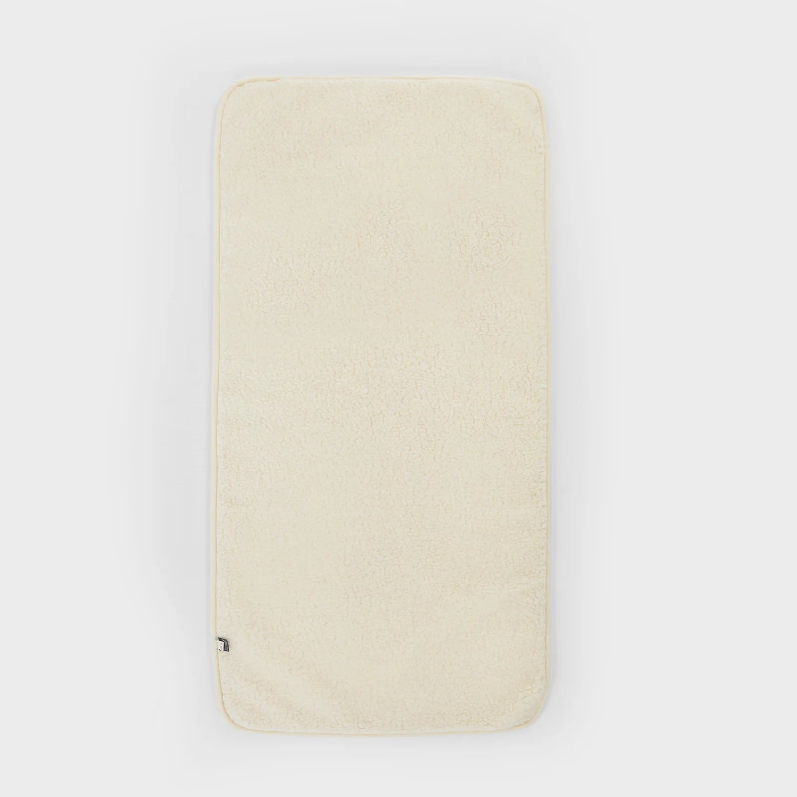 Merino wollen onderlegger ledikant 120x60 creme